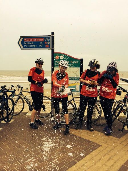 Cyclists celebrating.