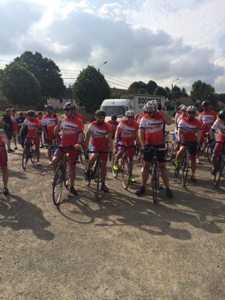 A group of cyclists getting ready for a ride.