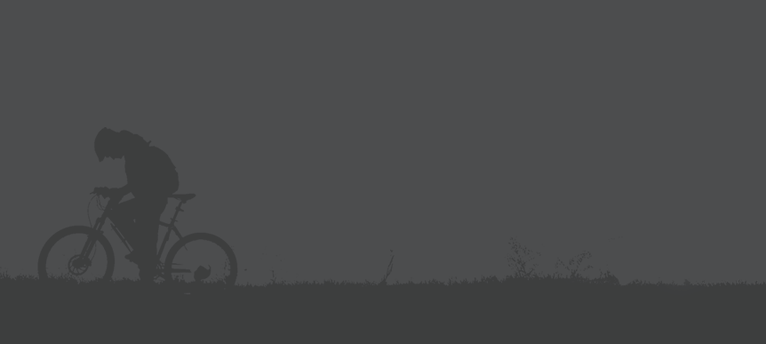 A silhouette of a cyclist.