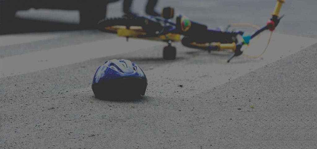 A dark background image showing a cycling RTA