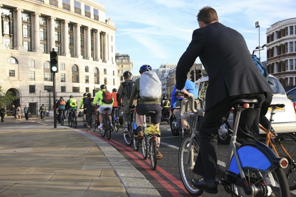 A group of cyclists in a bike lane.