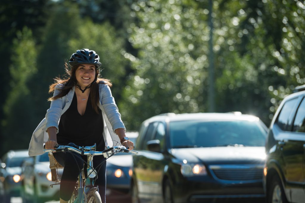 Woman commuting in a cycling lane.