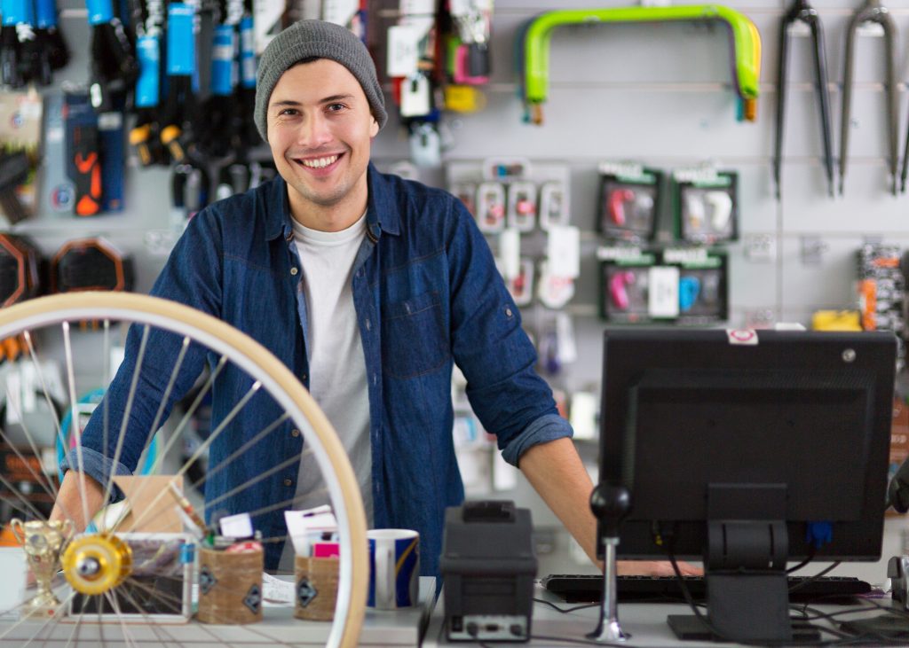 Salesman in bicycle shop.
