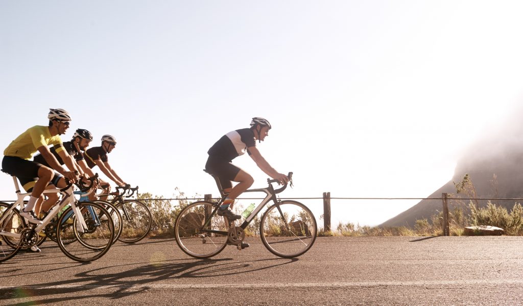 A cyclist breaking away from the pack.
