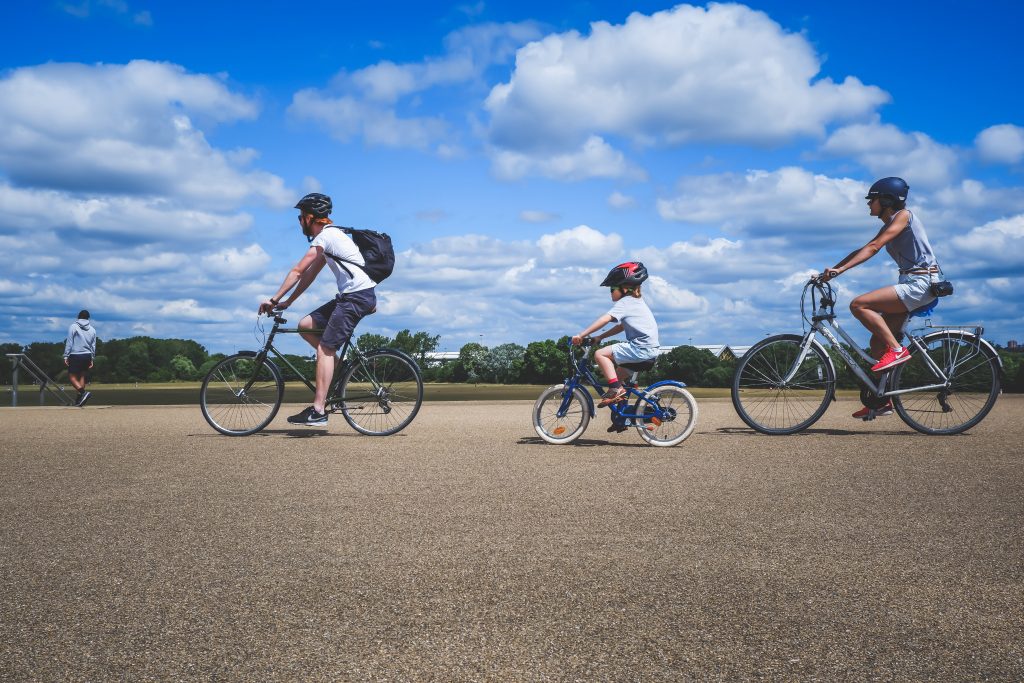 A family cycling together.