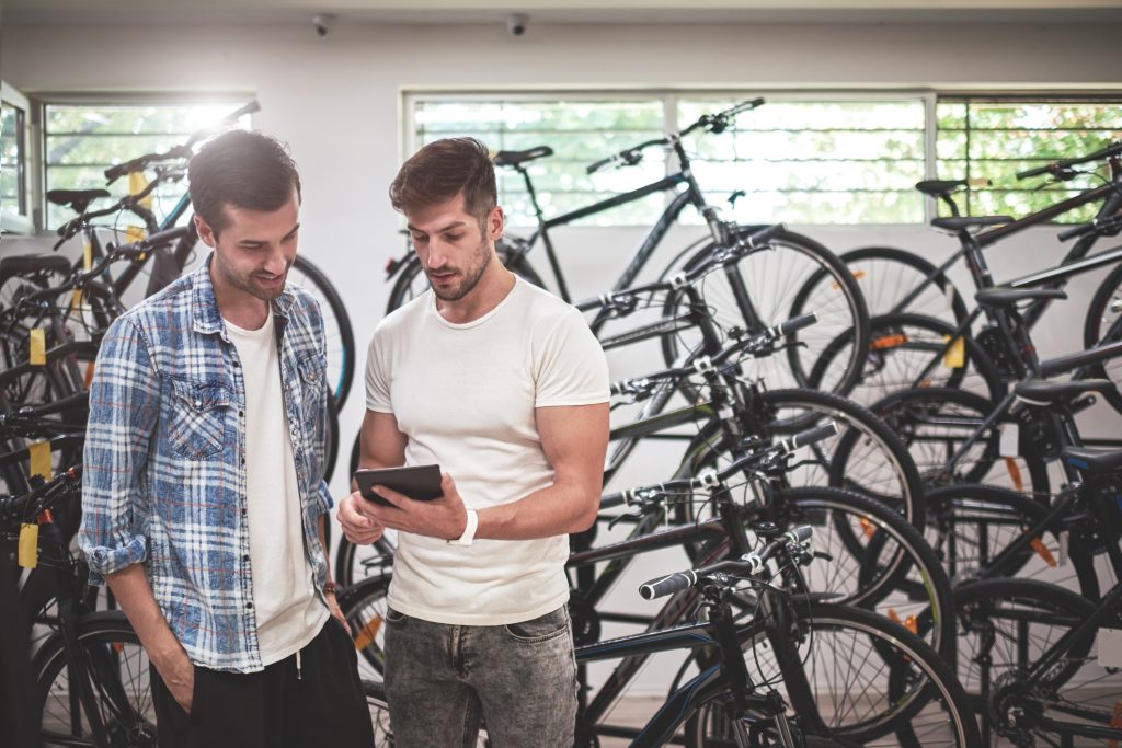 Men in bicycle store.