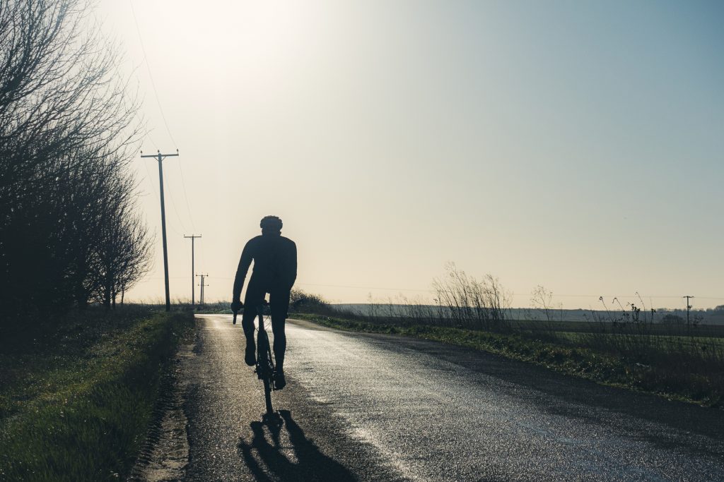 A silhouette of a cyclist.