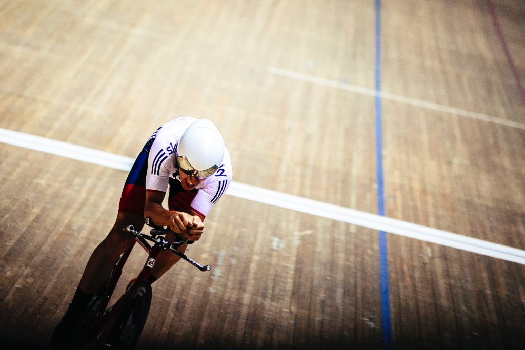 A cyclist at a velodrome.