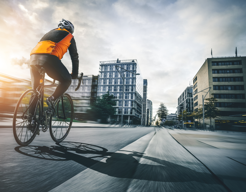 A cyclist in a built-up, urban area