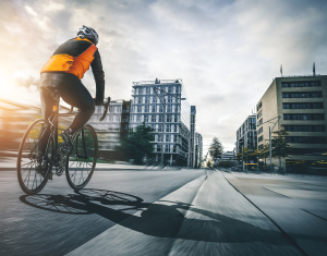 A cyclist in a built-up, urban area